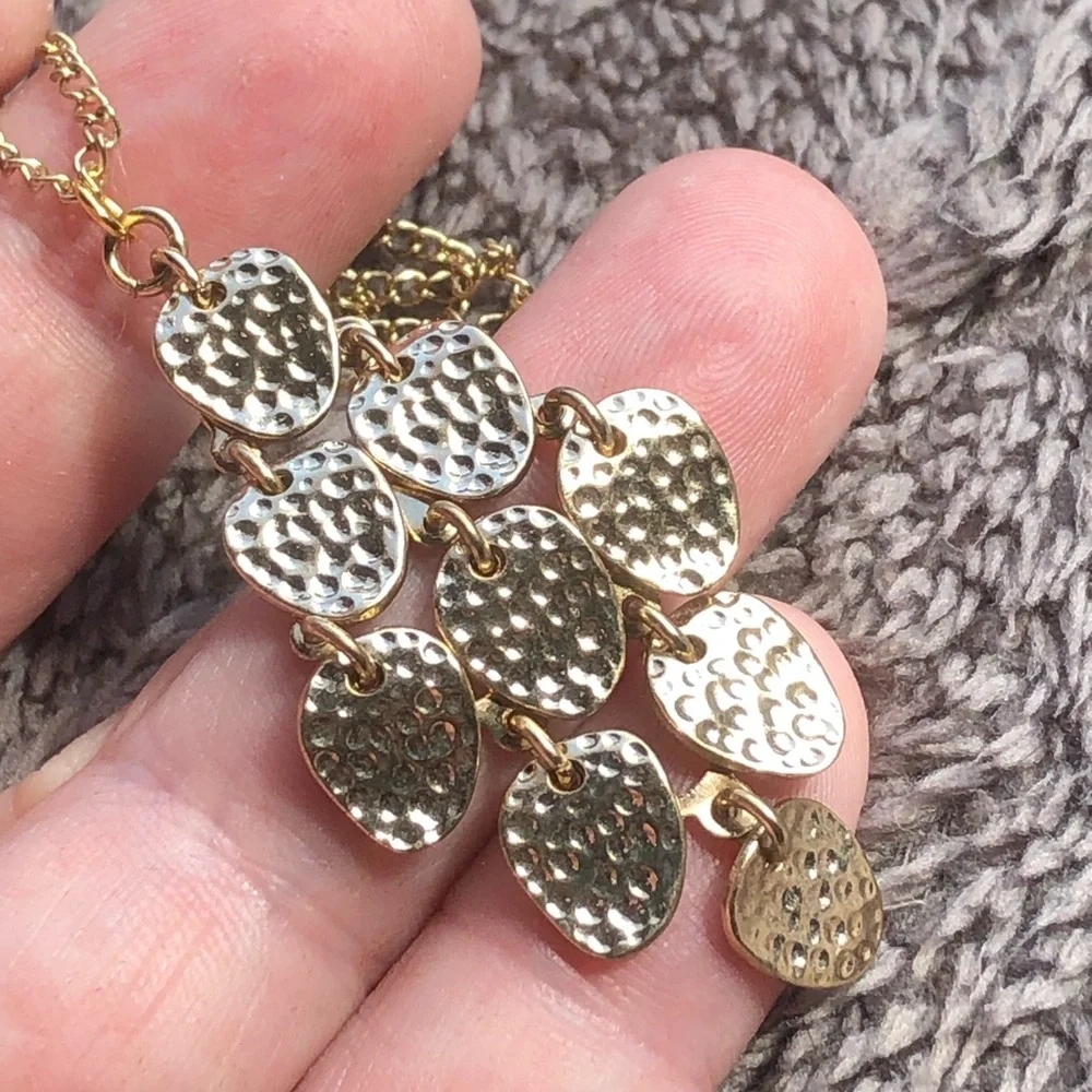 Shiny gold waterfall articulated pendant on chain necklace